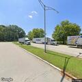 Disabled commercial truck with flat tires at rest area