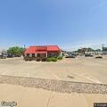 Traffic stop on blue truck at restaurant lot