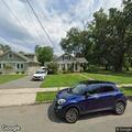 White SUV blocking driveway on Cherry Avenue