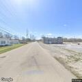 Abandoned car partially blocking roadway
