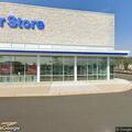 Traffic stop involving red vehicle near store