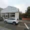Car blocking driveway in red zone at Main Street