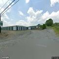 Vehicle crash into ditch near self storage facility