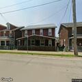 Resident reports homeless man sitting on street