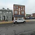 Man possibly having asthma attack on sidewalk
