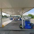 Debris and damaged guardrail near Mobil gas station