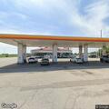 Irate customer causing disturbance at gas station