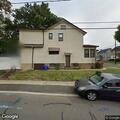 Person urinating in backyard on Crane Street