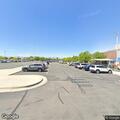 Person with muscle spasms and dislocated hip at high school parking lot