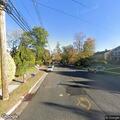 Gray Acura going wrong way on one-way street
