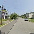 Two-car crash with fluid leak on Main Street