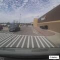 Man bleeding heavily from leg after fall in parking lot