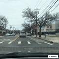 Car crash with smoking vehicle at Merrick Avenue