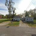 Caller reports unknown person inside home
