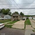 Woman attempts to enter home, talks with neighbor