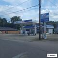 Oil spill flowing into sewer at business
