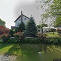 Person experiencing abdominal pain at residential address