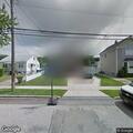 Person banging on door and window at home