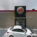 Car crashes into fence in Burger King parking lot