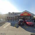 Officers stand by for vehicle repossession at diner