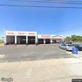 Suspicious open garage at tire shop at night