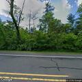 Large tree branch near roadway in Far Hills
