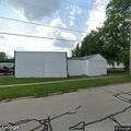 Officers check open doors at closed auto shop