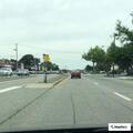 Minor crash between car and mail truck at gas station