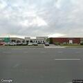 Suspicious person detained behind car dealership