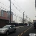 Traffic backup due to flashing signal at Marin and Grand