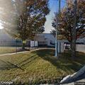 Suspicious white cargo van at business parking lot