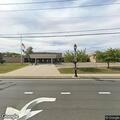Male with respiratory difficulties in front of high school