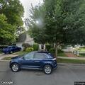 Person with back pains near Bergen Street in Floral Park