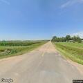 Irrigation pivot blocking road near power lines