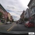 Person with leg and back pain at hotel on Main Street
