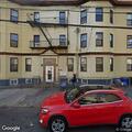 Broken window at residential building on Kennedy