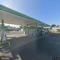 Suspicious vehicle parked behind gas station