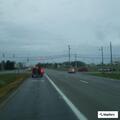 Unoccupied car blocking westbound lane near car wash