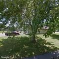 Woman experiencing nausea and vomiting at apartment