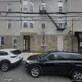 Fire alarms sounding in three-story residential building