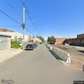 Small fire with burning branches on Valley Street