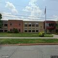 Woman with broken leg in school gymnasium
