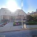Unresponsive person breathing on bus near municipal plaza