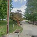 Burglar alarm and open door at home on Grand Street