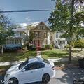 Officer marks parked black Ford Escape