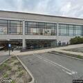 Female in car experiencing chest pain near mall