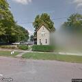 Loose dogs on front porch at 5th Street home