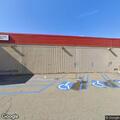 Oil container seal damage reported behind building