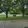Unattended three-wheeled bike at park shelter