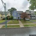 Officers check residence back door on Warren Place